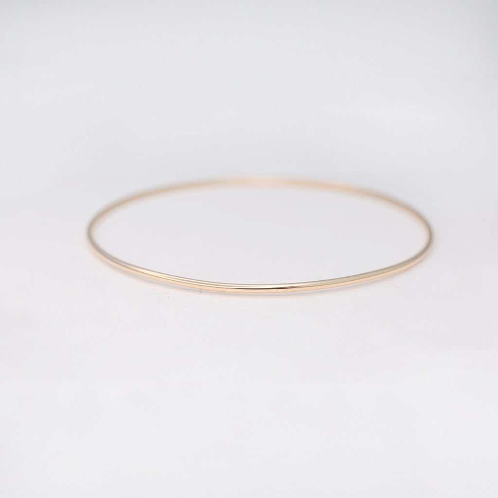 Minimalist handmade 14k solid gold stacking bangle