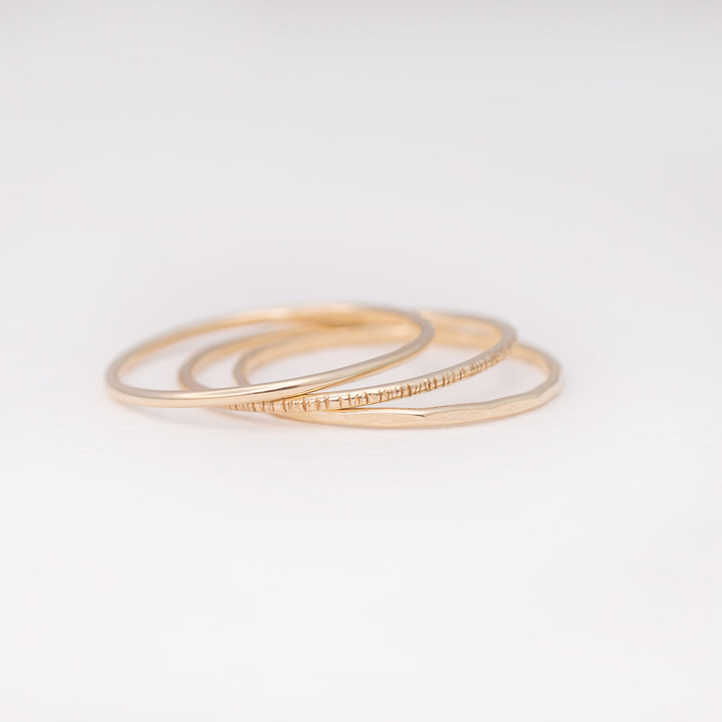 Minimalist handmade 14k solid gold stacking rings with in a smooth birch and faceted texture