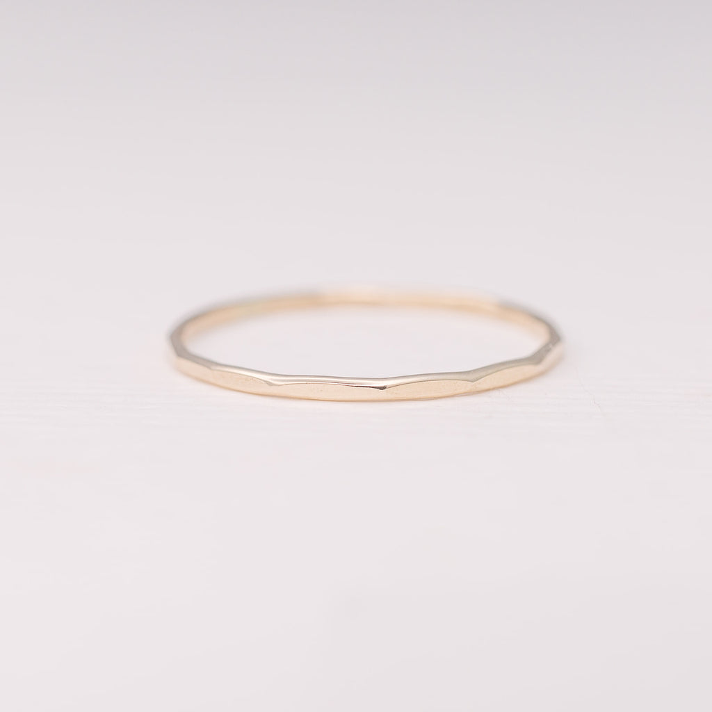 Minimalist handmade 14k solid gold stacking ring with a faceted texture