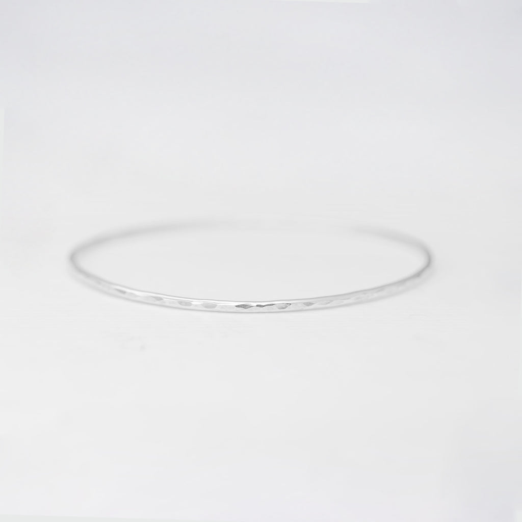 Minimalist handmade sterling silver hammered stacking bangle