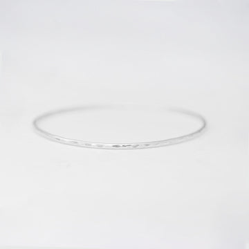 Minimalist handmade sterling silver hammered stacking bangle