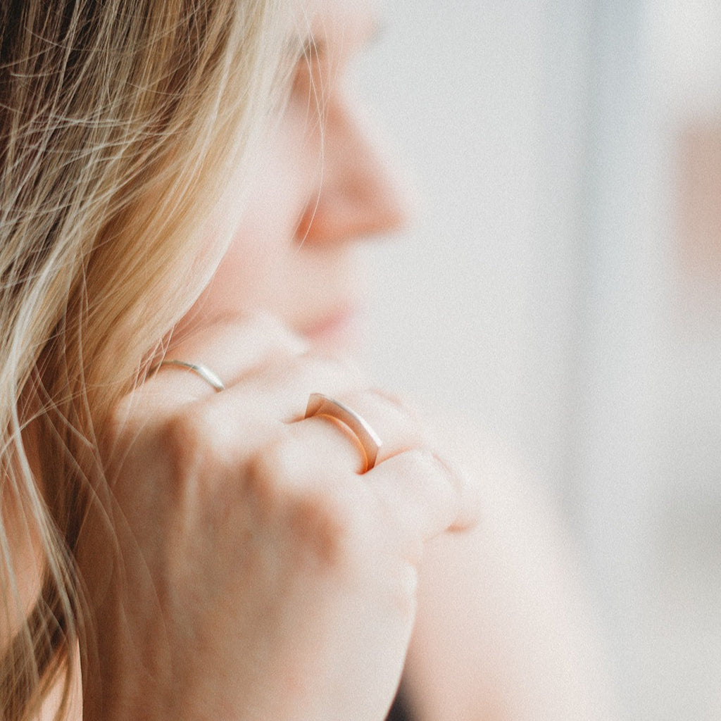 Woman wearing minimalist handmade sterling silver ring
